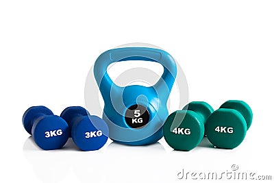 Set of kettlebell and dumbbells for gym training Stock Photo