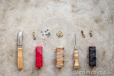 Set of leather craft tools on grey stone background top view copyspace Stock Photo