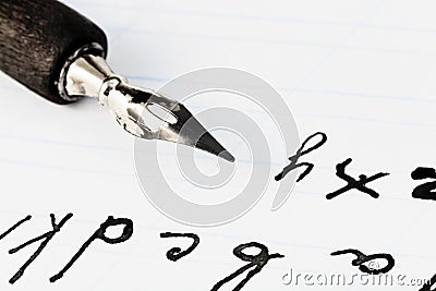 Set of letters and black ink nib of drawing pen Stock Photo