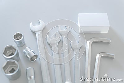 Set of a lot of different tools, such as: combination wrench, socket wrench, arm hexagons keys with blank of business card Stock Photo