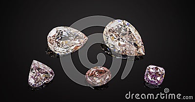 Set of luxury pink and purple transparent sparkling gemstones of various cut shape diamonds collage on black background Stock Photo