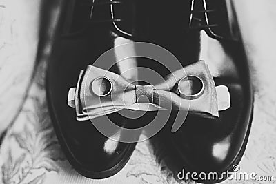 Set of mans fashion shoes with two golden wedding rings Stock Photo