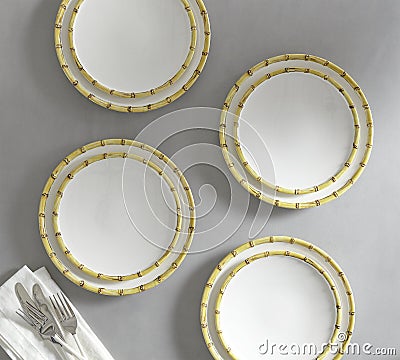 Set of 4 matching decorative plates for interior design - yellow waves. Stock Photo