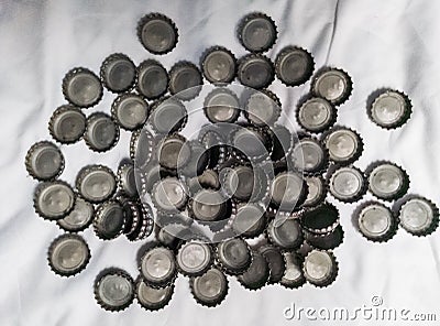 Set of metal bottle caps on white background, recycle aluminum to protect the environment Stock Photo
