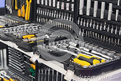 Set of metal tools for construction and repair close-up top view. Wrenches and other car service equipment in a case Stock Photo