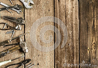 A set of metal tools in the workshop on an old rustic wooden background.concept.Father`s day or labor day holiday.A greeting card Stock Photo