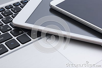 Set of modern computer devices - laptop, tablet and phone close up Stock Photo