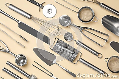 Set of modern cooking utensils on beige background, flat lay Stock Photo