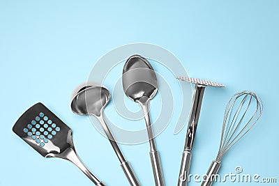 Set of modern cooking utensils on blue background, flat lay Stock Photo