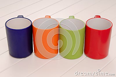 A set of mugs, assortment of colorful cups, red, green, blue, or Stock Photo