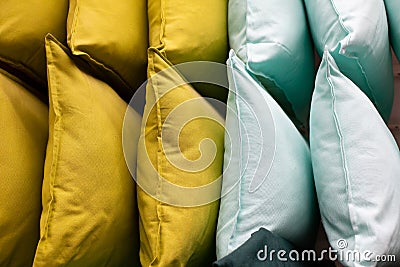 A set of multi-colored pillows in limbo in a supermarket. Stock Photo