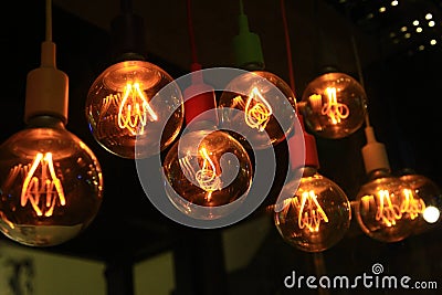 A set of old-style incandescent bulbs hanging on the ceiling Stock Photo