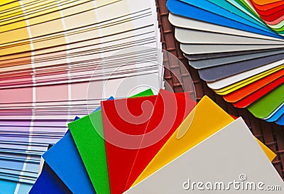 Set of open Pantone/RAL color cards on bamboo mat. Stock Photo