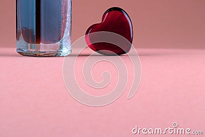 Set of parfume bottle and heart as a symbol of essential gift with love Stock Photo