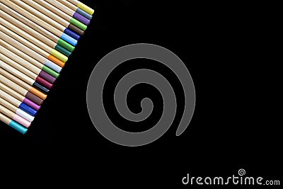Set of pens of different pencils on black background. Stock Photo