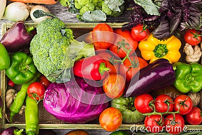 Set of raw vegetables in the wooden tray Stock Photo