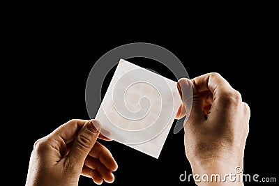 Set of round patches for acne in hands on black background. Close-up acne patch for facial rejuvenation. Facial Stock Photo