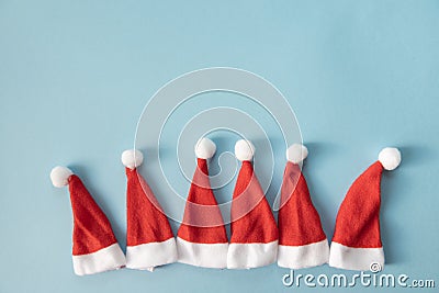Set of Santa Claus or gnomes hats on a light blue background. Christmas or New Year concept. Minimalism. Copy Space Stock Photo