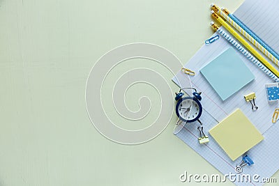 Set of school stationery back to school: pencils, clock, notepad, ruler on yellow background. education, lesson Stock Photo