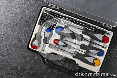 Set of screwdrivers inside toolbox, top view. Set mechanical tools in box Stock Photo