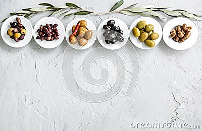 set of selected pickled olives in white bowls Stock Photo