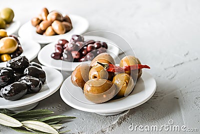 set of selected pickled olives in white bowls Stock Photo