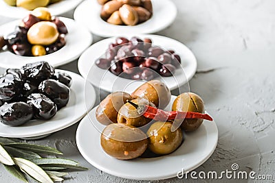 set of selected pickled olives in white bowls Stock Photo