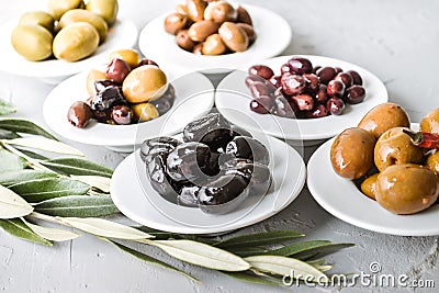 set of selected pickled olives in white bowls Stock Photo