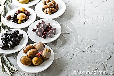 set of selected pickled olives in white bowls Stock Photo