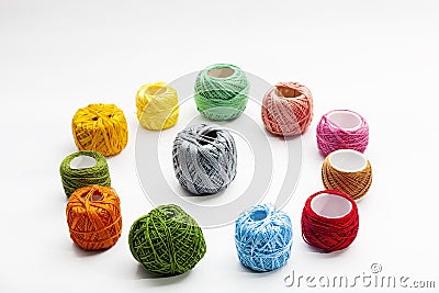 Set of several spools of thread of different colors on a white background. Stock Photo