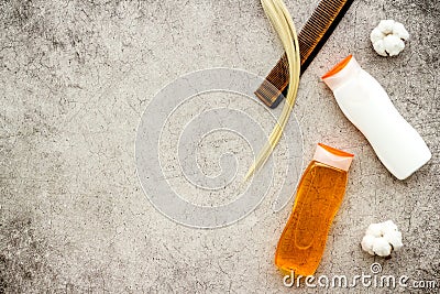 Set of spa and hair care herbal products with strand of blonde hair, top view Stock Photo