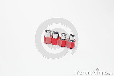 Set of stainless steel hex sockets on shiny white surface Stock Photo