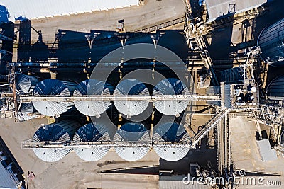 Set of storage tanks raw material agricultural crops feed mills. Aerial vew from drone Stock Photo