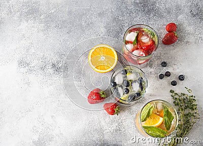 Set of summer healthy cocktails, various citrus infused waters, lemonades or mojitos, with lime and blueberries, orange and strawb Stock Photo