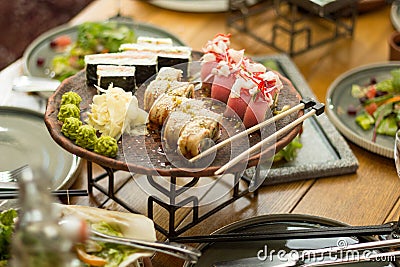 A set of sushi in a restaurant on the table, selective focus. Lunch Stock Photo