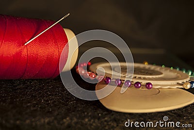 Set tailor: red thread with a needle, white chalk for drawing Stock Photo