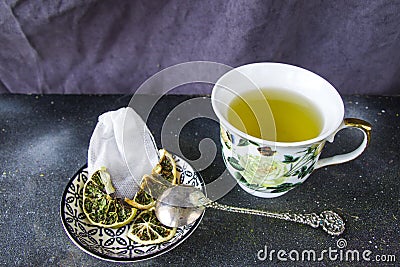 Set of tea, vintage silver spoons, various of tea and cup of tea Stock Photo