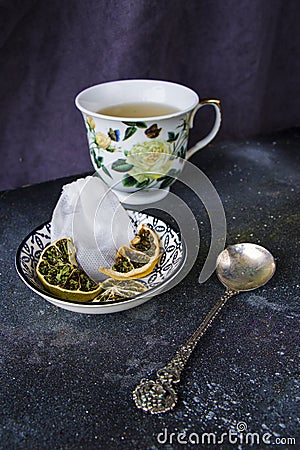 Set of tea, vintage silver spoons, various of tea and cup of tea Stock Photo