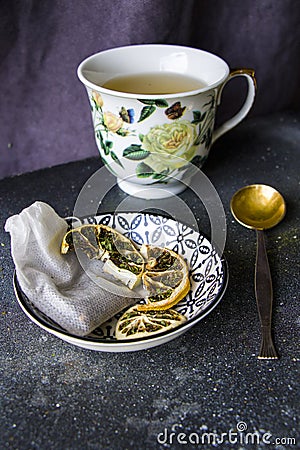 Set of tea, vintage silver spoons, various of tea and cup of tea Stock Photo