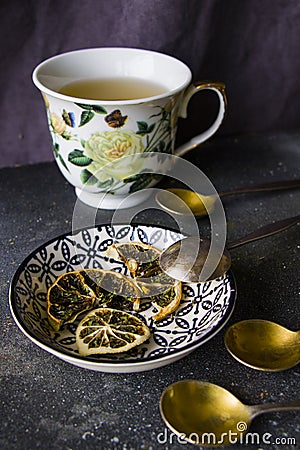 Set of tea, vintage silver spoons, various of tea and cup of tea Stock Photo