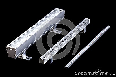 Set of three aluminum LED flood light bars for energy saving idustrial or decorative lightning isolated on black background Stock Photo
