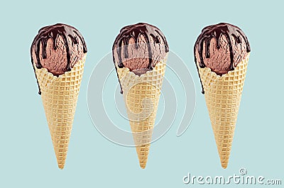 Set of three brown ice cream in crisp waffle cones with chocolate sauce on pastel green background, mock up. Stock Photo