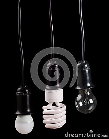 Set of three electric lamps in receptacle on black Stock Photo