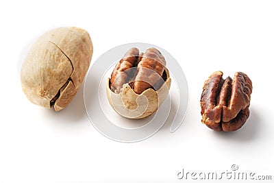 Set of three pecans in the center in a shell, peeled and without a shell isolated on a white background in a row Stock Photo