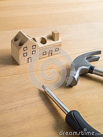 Set of tools and handmade wood house toy. Stock Photo