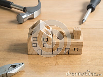 Set of tools and handmade wood house toy. Stock Photo