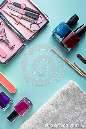 Set of tools for manicure and nail care on blue background. Spa hand procedure, place for text Stock Photo