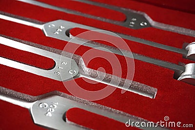 Set of Tuning Forks for hearing tests background . Medical equipment. Medical and Healthcare concept Stock Photo