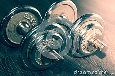 Set of two iron weights on the gym floor Stock Photo