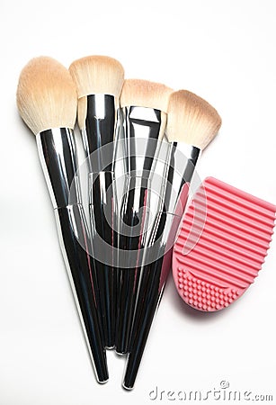 Set of used makeup brushes with metal handles and rubber brush c Stock Photo